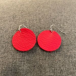 Red leather circle shaped pierced earrings